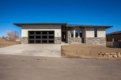 A stunning new home in Redlands Pinnacle Ridge Subdivision on The Golf Club At Redlands Mesa in Colorado - for sale on GolfHomes.com, golf home, golf lot