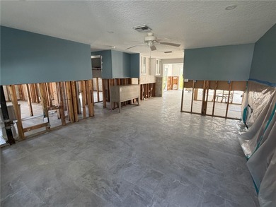 **THIS PROPERTY HAS FLOOD DAMAGE FROM HURRICANE HELENE** CASH on Mangrove Bay Golf Course in Florida - for sale on GolfHomes.com, golf home, golf lot