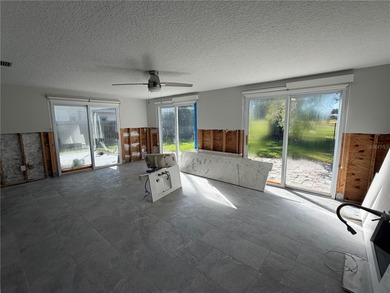 **THIS PROPERTY HAS FLOOD DAMAGE FROM HURRICANE HELENE** CASH on Mangrove Bay Golf Course in Florida - for sale on GolfHomes.com, golf home, golf lot