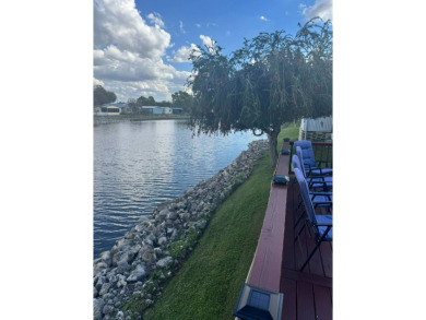 This home has so much to offer it's hard to even decide where to on Golden Lakes Golf Course in Florida - for sale on GolfHomes.com, golf home, golf lot