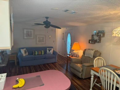This home has so much to offer it's hard to even decide where to on Golden Lakes Golf Course in Florida - for sale on GolfHomes.com, golf home, golf lot
