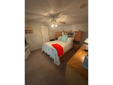 This home has so much to offer it's hard to even decide where to on Golden Lakes Golf Course in Florida - for sale on GolfHomes.com, golf home, golf lot