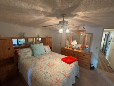 This home has so much to offer it's hard to even decide where to on Golden Lakes Golf Course in Florida - for sale on GolfHomes.com, golf home, golf lot