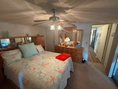This home has so much to offer it's hard to even decide where to on Golden Lakes Golf Course in Florida - for sale on GolfHomes.com, golf home, golf lot
