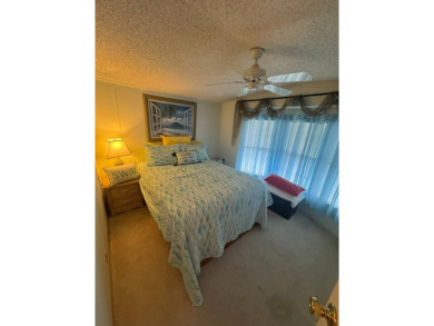 This home has so much to offer it's hard to even decide where to on Golden Lakes Golf Course in Florida - for sale on GolfHomes.com, golf home, golf lot