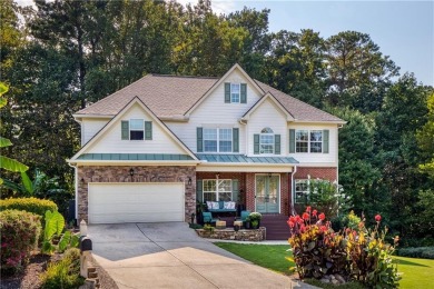 Price to move, this custom-built home sits on a roundabout on Hampton Golf Village in Georgia - for sale on GolfHomes.com, golf home, golf lot