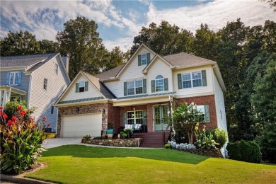 Price to move, this custom-built home sits on a roundabout on Hampton Golf Village in Georgia - for sale on GolfHomes.com, golf home, golf lot