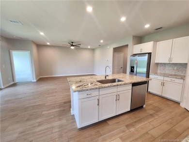 This like-new 3/2/2 home in Jensen Beach offers a perfect blend on Eagle Marsh Golf Club in Florida - for sale on GolfHomes.com, golf home, golf lot
