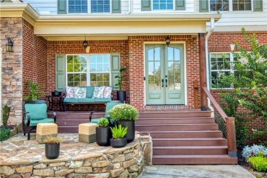 Price to move, this custom-built home sits on a roundabout on Hampton Golf Village in Georgia - for sale on GolfHomes.com, golf home, golf lot