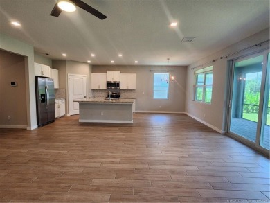 This like-new 3/2/2 home in Jensen Beach offers a perfect blend on Eagle Marsh Golf Club in Florida - for sale on GolfHomes.com, golf home, golf lot
