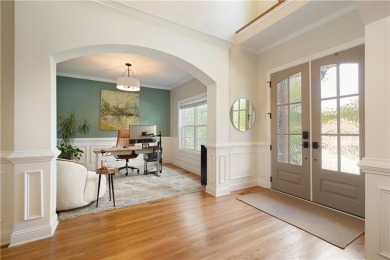 Price to move, this custom-built home sits on a roundabout on Hampton Golf Village in Georgia - for sale on GolfHomes.com, golf home, golf lot