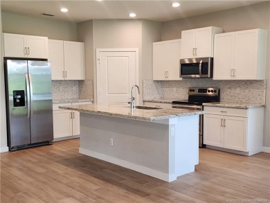 This like-new 3/2/2 home in Jensen Beach offers a perfect blend on Eagle Marsh Golf Club in Florida - for sale on GolfHomes.com, golf home, golf lot