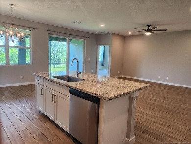 This like-new 3/2/2 home in Jensen Beach offers a perfect blend on Eagle Marsh Golf Club in Florida - for sale on GolfHomes.com, golf home, golf lot