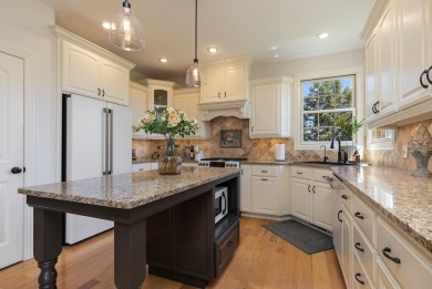 This stunning all-brick and stone home in the prestigious on Rivercut Golf Course in Missouri - for sale on GolfHomes.com, golf home, golf lot