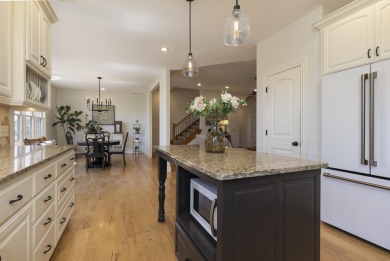 This stunning all-brick and stone home in the prestigious on Rivercut Golf Course in Missouri - for sale on GolfHomes.com, golf home, golf lot