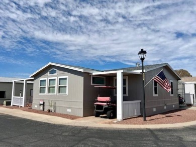 SELLER TO PAY LOT UNTIL SEPT 1, 2024***This beautiful move in on Voyager RV Resort and Golf Course in Arizona - for sale on GolfHomes.com, golf home, golf lot
