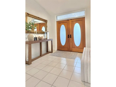 Hurry and take a look at this tropical, spacious pool home in La on Woodmont Country Club in Florida - for sale on GolfHomes.com, golf home, golf lot