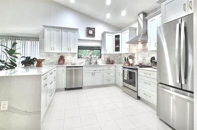 Hurry and take a look at this tropical, spacious pool home in La on Woodmont Country Club in Florida - for sale on GolfHomes.com, golf home, golf lot