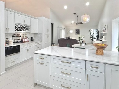 Hurry and take a look at this tropical, spacious pool home in La on Woodmont Country Club in Florida - for sale on GolfHomes.com, golf home, golf lot