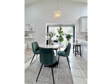 Hurry and take a look at this tropical, spacious pool home in La on Woodmont Country Club in Florida - for sale on GolfHomes.com, golf home, golf lot