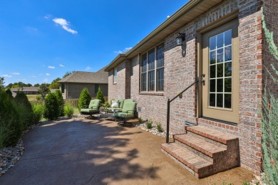 This stunning all-brick and stone home in the prestigious on Rivercut Golf Course in Missouri - for sale on GolfHomes.com, golf home, golf lot