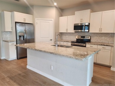 Almost new concrete home w/concrete tile roof in Jensen Beach! on Eagle Marsh Golf Club in Florida - for sale on GolfHomes.com, golf home, golf lot