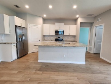 Almost new concrete home w/concrete tile roof in Jensen Beach! on Eagle Marsh Golf Club in Florida - for sale on GolfHomes.com, golf home, golf lot