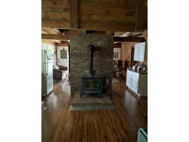 Welcome Home! Located on 10.05 acres, this 4 bedroom, 2 bath on Lake St. Catherine Country Club in Vermont - for sale on GolfHomes.com, golf home, golf lot
