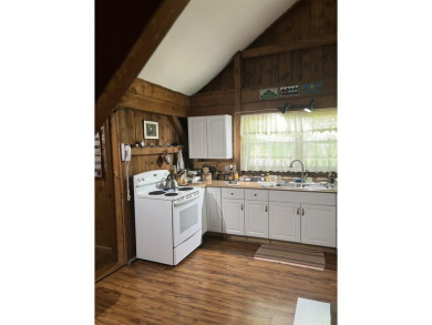 Welcome Home! Located on 10.05 acres, this 4 bedroom, 2 bath on Lake St. Catherine Country Club in Vermont - for sale on GolfHomes.com, golf home, golf lot