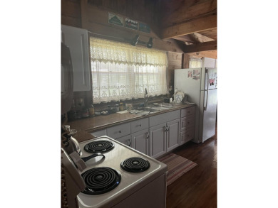 Welcome Home! Located on 10.05 acres, this 4 bedroom, 2 bath on Lake St. Catherine Country Club in Vermont - for sale on GolfHomes.com, golf home, golf lot