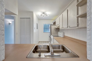 Experience resort-style living in this spacious 2-bedroom on  in Florida - for sale on GolfHomes.com, golf home, golf lot