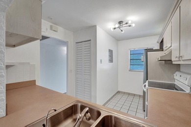 Experience resort-style living in this spacious 2-bedroom on  in Florida - for sale on GolfHomes.com, golf home, golf lot