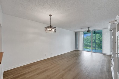 Experience resort-style living in this spacious 2-bedroom on  in Florida - for sale on GolfHomes.com, golf home, golf lot