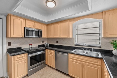 Price Improvement!  Fully updated!  Bring your golf clubs and on East Lake Woodlands Country Club in Florida - for sale on GolfHomes.com, golf home, golf lot