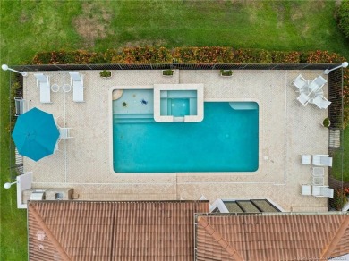 Enjoy natural light and serene views overlooking the lake, pool on Pipers Landing Country Club in Florida - for sale on GolfHomes.com, golf home, golf lot