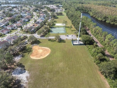 Welcome to this beautifully updated 3-bedroom, 2-bathroom home on Westchase Golf Club in Florida - for sale on GolfHomes.com, golf home, golf lot