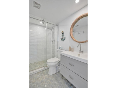 Beautifully renovated 2-bedroom condo sold fully furnished and on Palm-Aire Country Club and Resort - Palms in Florida - for sale on GolfHomes.com, golf home, golf lot
