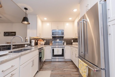 This end unit in The Dwellings has all the upgrades! One owner on Indian Hills Golf Club in Iowa - for sale on GolfHomes.com, golf home, golf lot
