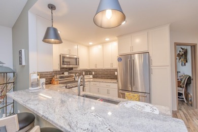 This end unit in The Dwellings has all the upgrades! One owner on Indian Hills Golf Club in Iowa - for sale on GolfHomes.com, golf home, golf lot