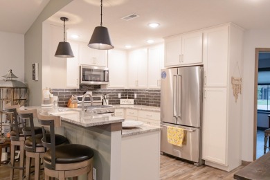 This end unit in The Dwellings has all the upgrades! One owner on Indian Hills Golf Club in Iowa - for sale on GolfHomes.com, golf home, golf lot