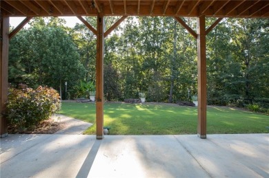 Tucked away on a wooded lot in Cresswind at Lake Lanier, a on Lanier Island Legacy Golf Couorse in Georgia - for sale on GolfHomes.com, golf home, golf lot