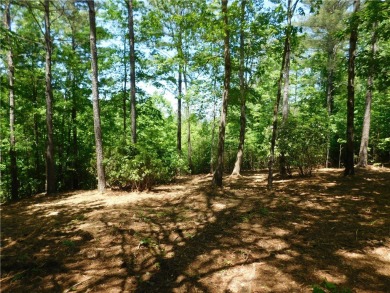 Beautifully wooded lot with gentle build site and some long on The Cliffs At Keowee Falls in South Carolina - for sale on GolfHomes.com, golf home, golf lot