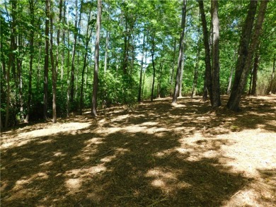 Beautifully wooded lot with gentle build site and some long on The Cliffs At Keowee Falls in South Carolina - for sale on GolfHomes.com, golf home, golf lot
