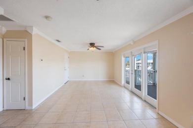 Sporting pastel-colored, Bermuda-styled exteriors, this on St. Petersburg Country Club in Florida - for sale on GolfHomes.com, golf home, golf lot