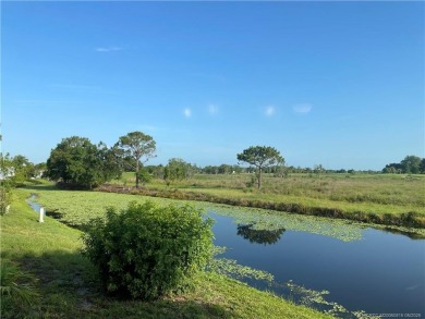 What a view! Canal! Wildlife! Golf! You have it all from your on Indianwood Golf and Country Club in Florida - for sale on GolfHomes.com, golf home, golf lot