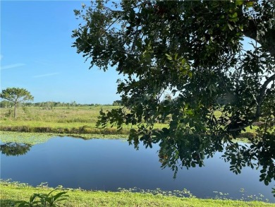 What a view! Canal! Wildlife! Golf! You have it all from your on Indianwood Golf and Country Club in Florida - for sale on GolfHomes.com, golf home, golf lot