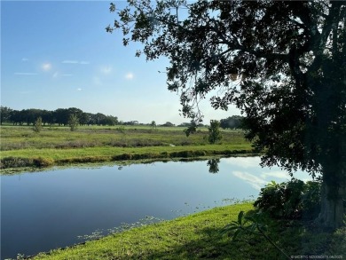 What a view! Canal! Wildlife! Golf! You have it all from your on Indianwood Golf and Country Club in Florida - for sale on GolfHomes.com, golf home, golf lot
