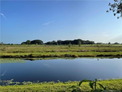 What a view! Canal! Wildlife! Golf! You have it all from your on Indianwood Golf and Country Club in Florida - for sale on GolfHomes.com, golf home, golf lot