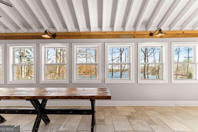 A stone's throw from the water's edge, this lakefront cottage is on Chattahoochee Golf Course in Georgia - for sale on GolfHomes.com, golf home, golf lot