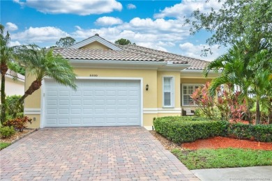 This Bermuda with it's inviting front porch and open-kitchen on The Florida Club in Florida - for sale on GolfHomes.com, golf home, golf lot